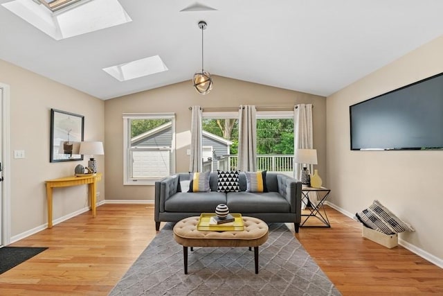 636 N Greenview Ave, Mundelein, IL 60060 - living room featuring a skylight, light wood-type flooring, plenty of natural light, and lofted ceiling