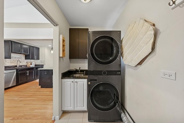 636 N Greenview Ave, Mundelein, IL 60060 - laundry area with stacked washing machine and dryer, cabinet space, and light wood-type flooring