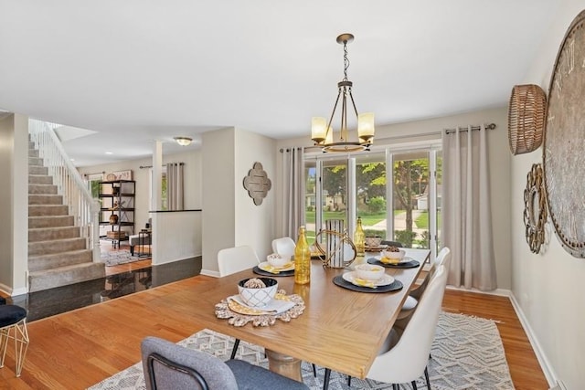 636 N Greenview Ave, Mundelein, IL 60060 - dining room with wood finished floors, a chandelier, and stairway