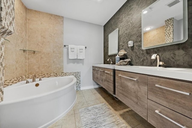 636 N Greenview Ave, Mundelein, IL 60060 - bathroom featuring a tub, tile patterned flooring, double vanity, and tile walls