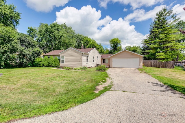 37369 N Loretto Ave, Lake Villa, IL 60046 - ranch-style house with driveway, an attached garage, an outbuilding, and a chimney