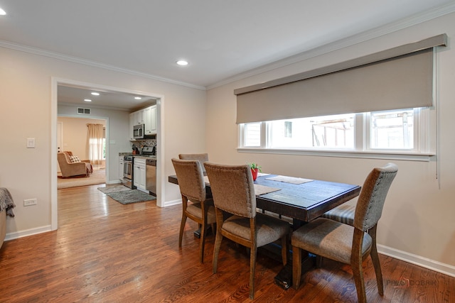 37369 N Loretto Ave, Lake Villa, IL 60046 - dining space featuring recessed lighting, crown molding, and wood finished floors