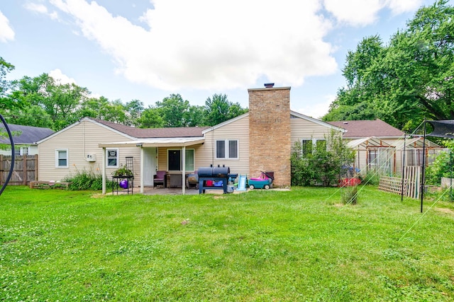 37369 N Loretto Ave, Lake Villa, IL 60046 - back of property with a patio, a chimney, and an outdoor living space