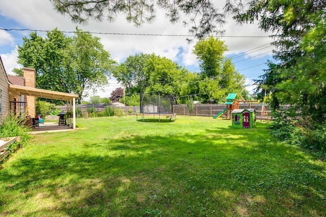 37369 N Loretto Ave, Lake Villa, IL 60046 - fenced backyard with a trampoline and a playground