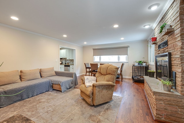 37369 N Loretto Ave, Lake Villa, IL 60046 - living room featuring a fireplace, recessed lighting, ornamental molding, and wood finished floors