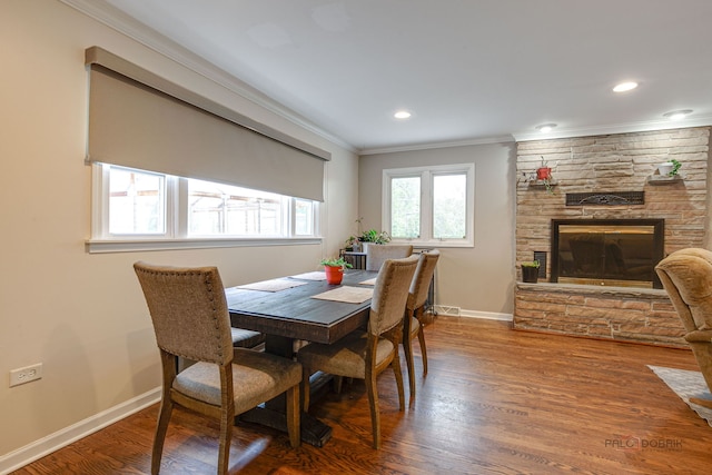 37369 N Loretto Ave, Lake Villa, IL 60046 - dining room with ornamental molding, a stone fireplace, wood finished floors, and recessed lighting