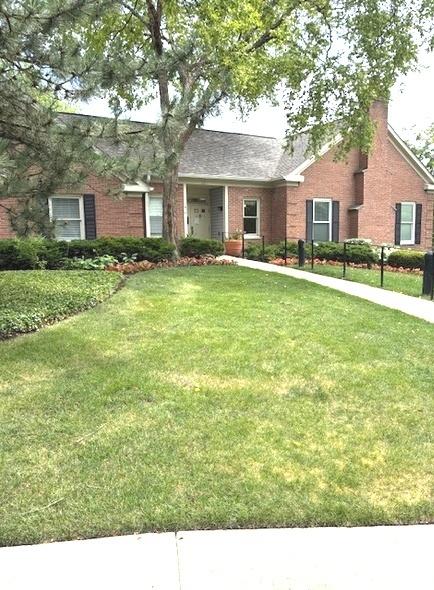 1620 Hadley Ct Unit A2, Wheeling, IL 60090 - view of front of property featuring brick siding, a front yard, roof with shingles, and a chimney