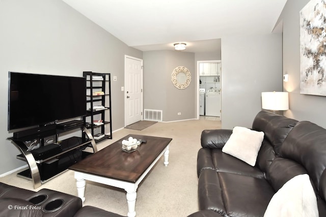 1620 Hadley Ct Unit A2, Wheeling, IL 60090 - carpeted living room featuring washing machine and dryer and baseboards