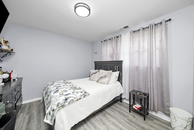 10302 W Palmer Ave, Melrose Park, IL 60164 - bedroom featuring wood finished floors and baseboards