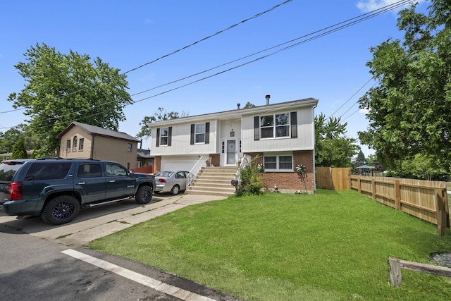 10302 W Palmer Ave, Melrose Park, IL 60164 - split foyer home featuring brick siding, a garage, and driveway