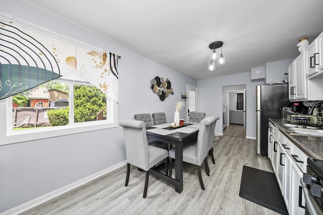 10302 W Palmer Ave, Melrose Park, IL 60164 - dining area featuring light wood finished floors and baseboards