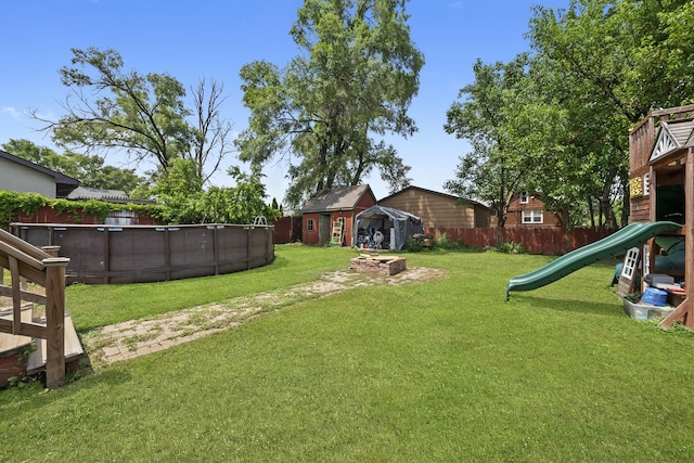 10302 W Palmer Ave, Melrose Park, IL 60164 - fenced backyard featuring a playground
