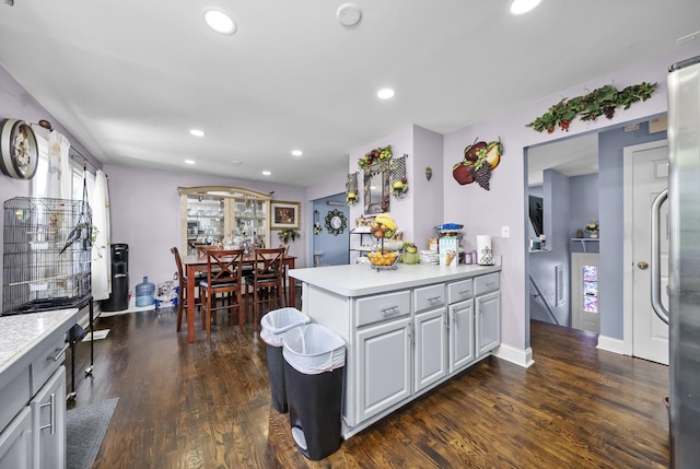 10302 W Palmer Ave, Melrose Park, IL 60164 - kitchen with light countertops, dark wood-style flooring, recessed lighting, and a peninsula