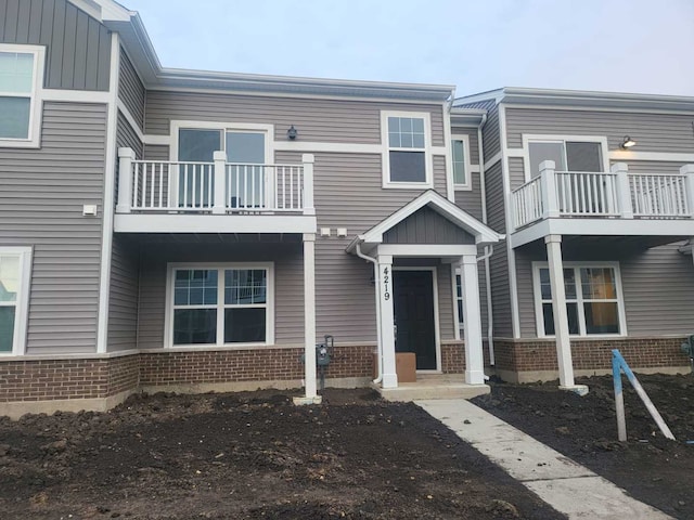 4219 Chelsea Manor Cir, Aurora, IL 60504 - view of front of property with brick siding and a balcony