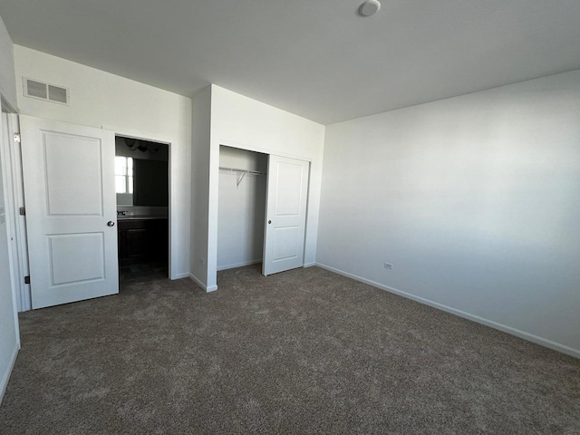4219 Chelsea Manor Cir, Aurora, IL 60504 - unfurnished bedroom with dark colored carpet and a closet