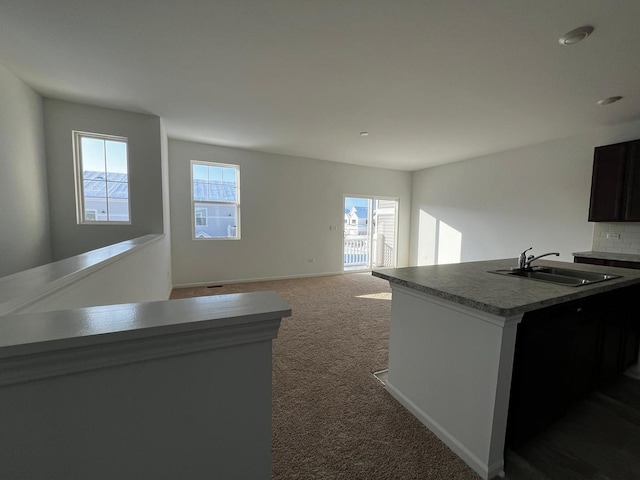 4219 Chelsea Manor Cir, Aurora, IL 60504 - kitchen featuring healthy amount of natural light, carpet flooring, and decorative backsplash