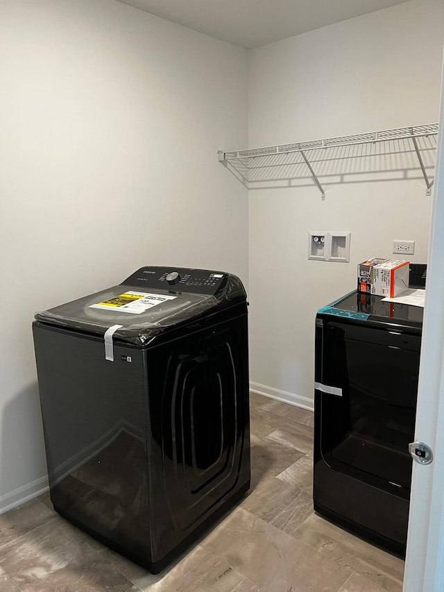 4219 Chelsea Manor Cir, Aurora, IL 60504 - washroom featuring baseboards and washer hookup