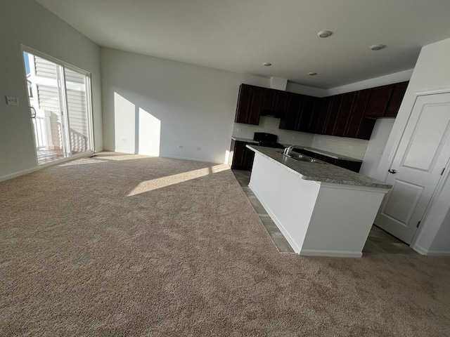 4219 Chelsea Manor Cir, Aurora, IL 60504 - kitchen with carpet flooring, a kitchen island with sink, and backsplash