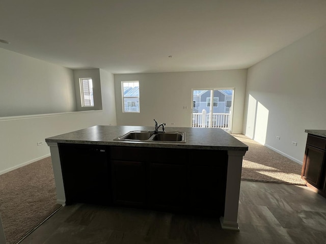 4219 Chelsea Manor Cir, Aurora, IL 60504 - kitchen with dark countertops, open floor plan, a center island with sink, and dark carpet