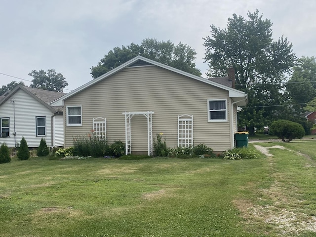 308 S 5th Ave, Streator, IL 61364 - view of side of property featuring a lawn and a chimney