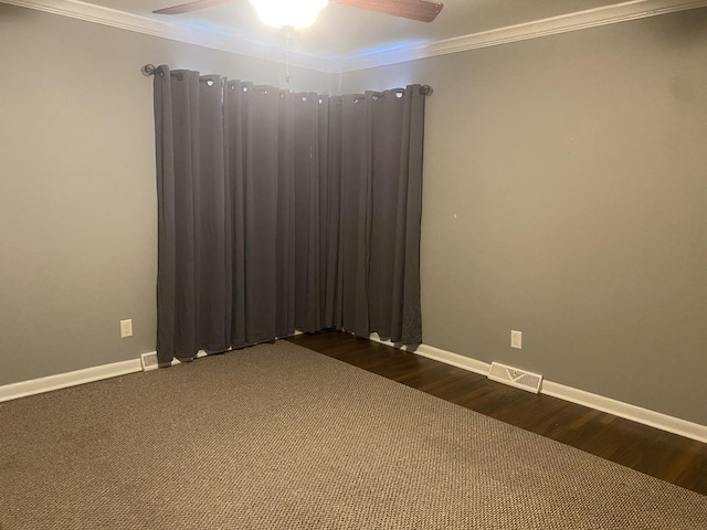308 S 5th Ave, Streator, IL 61364 - empty room featuring dark wood-style floors, ornamental molding, and a ceiling fan