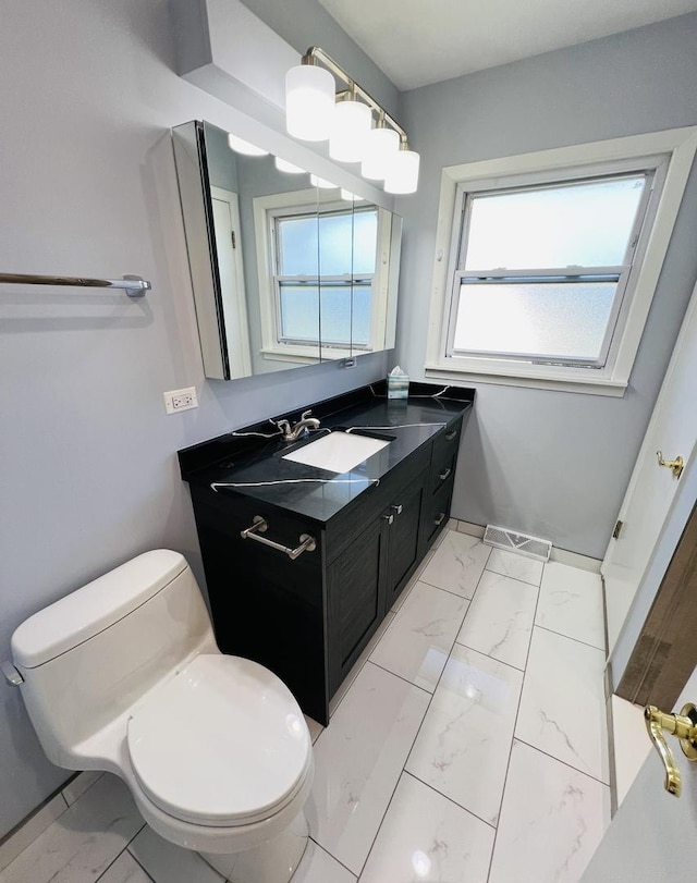 189 Ambleside Rd, Des Plaines, IL 60016 - bathroom featuring marble look tiles and vanity