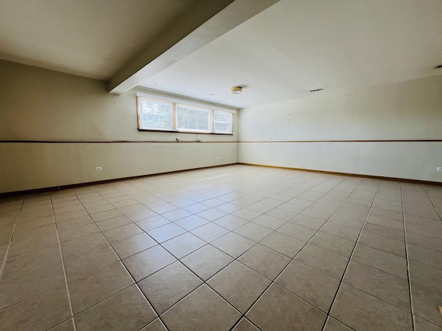 189 Ambleside Rd, Des Plaines, IL 60016 - spare room featuring tile patterned floors and beam ceiling