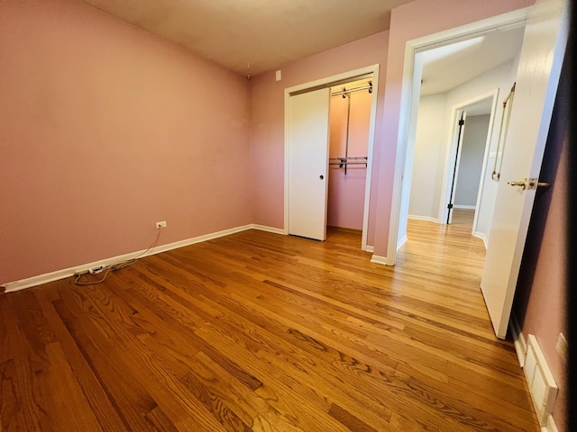 189 Ambleside Rd, Des Plaines, IL 60016 - unfurnished bedroom featuring wood finished floors and a closet