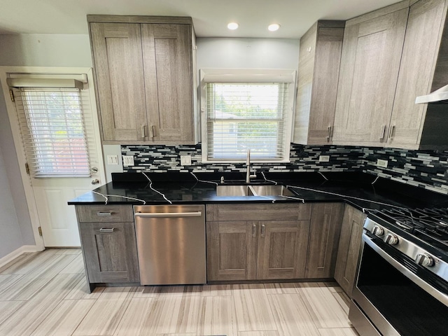 189 Ambleside Rd, Des Plaines, IL 60016 - kitchen with stainless steel appliances, dark countertops, decorative backsplash, wall chimney range hood, and recessed lighting