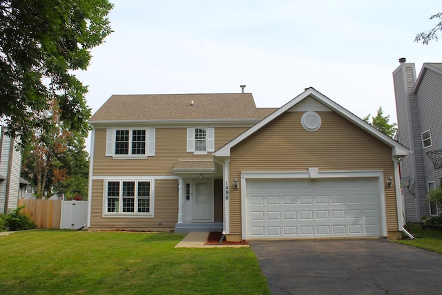 1098 Clover Hill Ln, Elgin, IL 60120 - traditional-style house with asphalt driveway and a garage