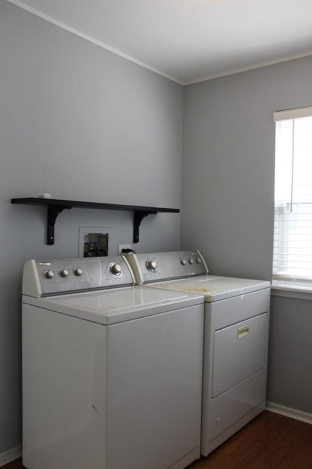 1098 Clover Hill Ln, Elgin, IL 60120 - laundry area with washer and clothes dryer, dark wood-style floors, and crown molding