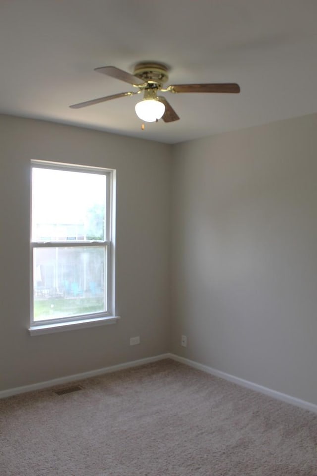 1098 Clover Hill Ln, Elgin, IL 60120 - carpeted empty room with ceiling fan and plenty of natural light