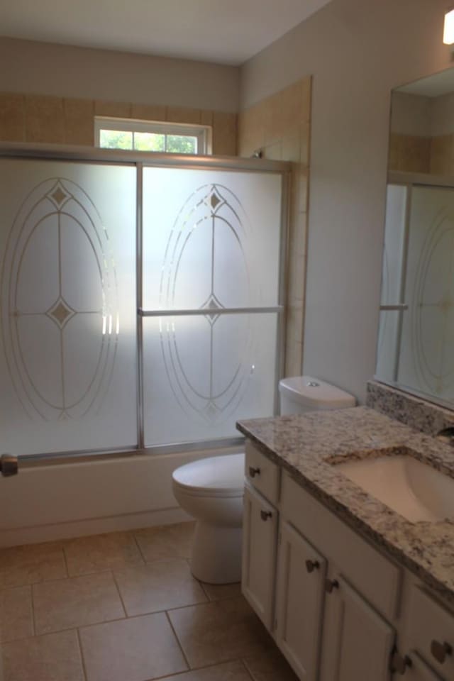 1098 Clover Hill Ln, Elgin, IL 60120 - bathroom with vanity, bath / shower combo with glass door, and tile patterned flooring