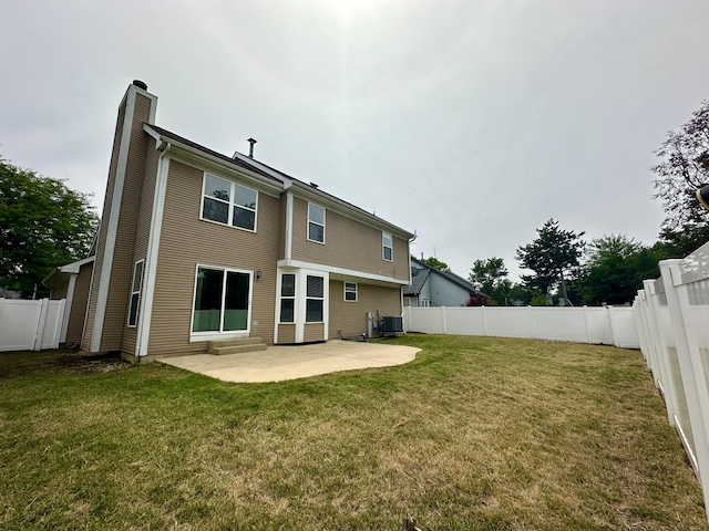1098 Clover Hill Ln, Elgin, IL 60120 - rear view of house featuring a chimney, a patio, and a fenced backyard