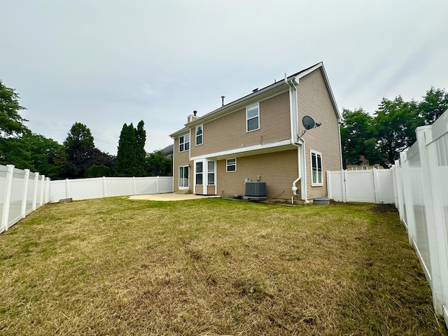 1098 Clover Hill Ln, Elgin, IL 60120 - back of property with a patio, a fenced backyard, and a chimney