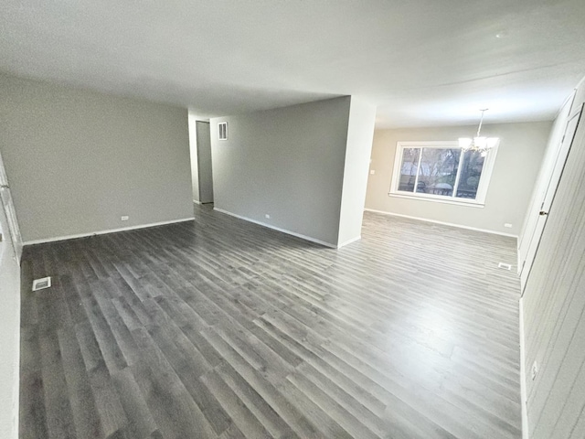 1034 E Tulip Way, Palatine, IL 60074 - unfurnished living room with a chandelier and dark wood-style floors
