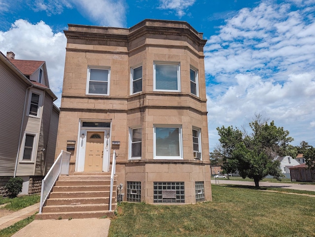 104 W 112th Pl, Chicago, IL 60628 - view of front facade featuring a front lawn and cooling unit