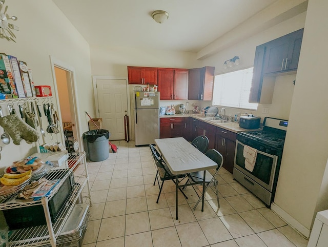 104 W 112th Pl, Chicago, IL 60628 - kitchen featuring appliances with stainless steel finishes, dark brown cabinets, light tile patterned floors, and light countertops
