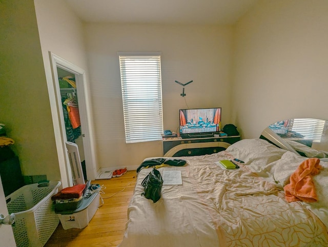 104 W 112th Pl, Chicago, IL 60628 - bedroom featuring wood finished floors and baseboards