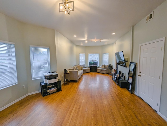 104 W 112th Pl, Chicago, IL 60628 - living area with light wood-style flooring, recessed lighting, and a fireplace