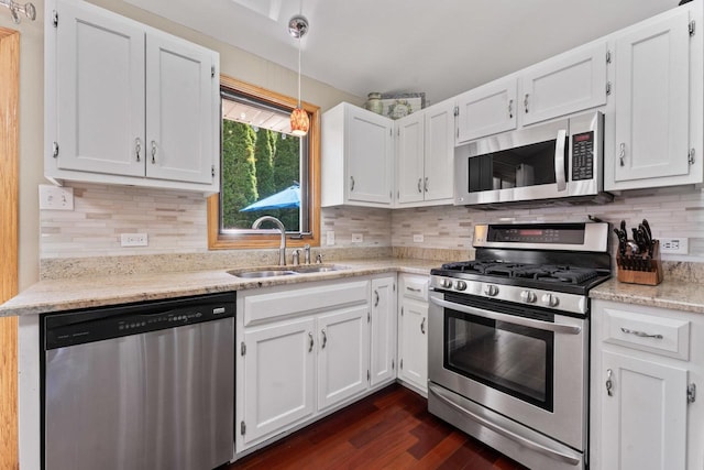 17019 Danielle Ct, Oak Forest, IL 60452 - kitchen with stainless steel appliances, white cabinetry, dark wood-type flooring, decorative backsplash, and light stone counters