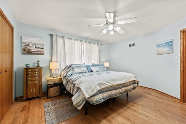 17019 Danielle Ct, Oak Forest, IL 60452 - bedroom with light wood-style floors, a closet, and ceiling fan