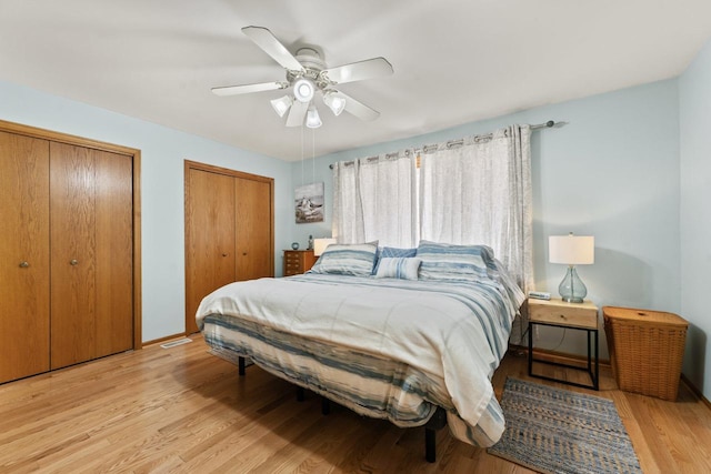 17019 Danielle Ct, Oak Forest, IL 60452 - bedroom with two closets, light wood-style floors, and a ceiling fan