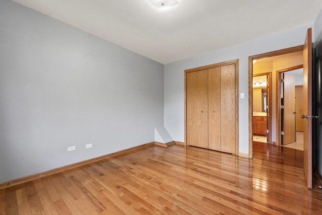17019 Danielle Ct, Oak Forest, IL 60452 - unfurnished bedroom featuring light wood-style flooring and a closet