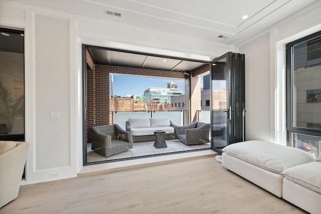 116 N Willard Ct Unit 301, Chicago, IL 60607 - bedroom with wood finished floors, access to exterior, recessed lighting, and brick wall