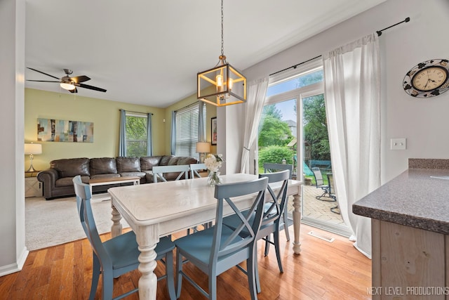 1211 Hall St, Sugar Grove, IL 60554 - dining space with light wood finished floors, a chandelier, and ceiling fan