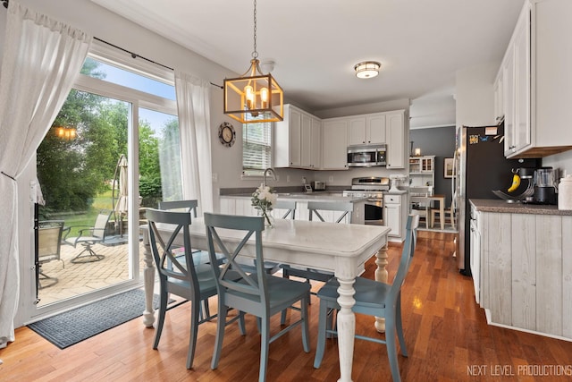 1211 Hall St, Sugar Grove, IL 60554 - dining area featuring wood finished floors and a chandelier