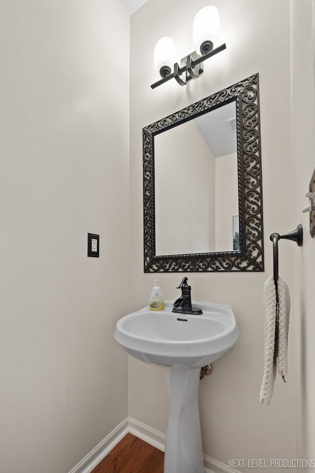 1211 Hall St, Sugar Grove, IL 60554 - bathroom with baseboards and wood finished floors