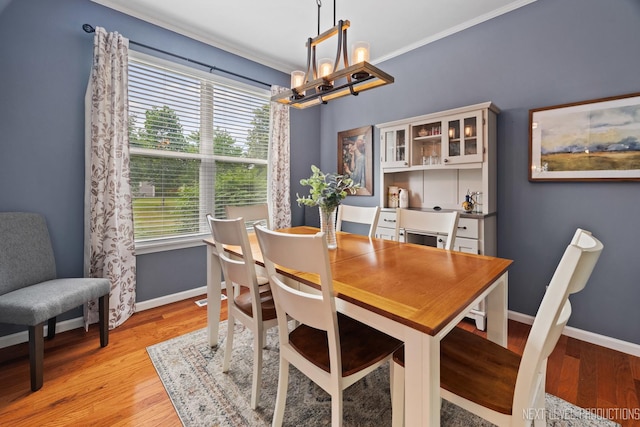 1211 Hall St, Sugar Grove, IL 60554 - dining room with a chandelier, ornamental molding, and light wood-style flooring