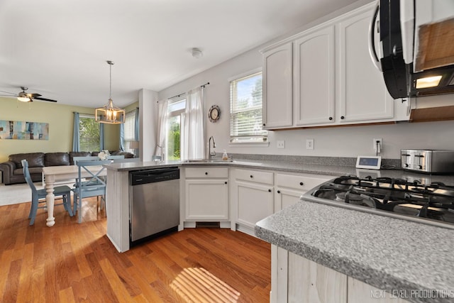 1211 Hall St, Sugar Grove, IL 60554 - kitchen featuring stainless steel dishwasher, light wood-type flooring, white cabinets, and open floor plan